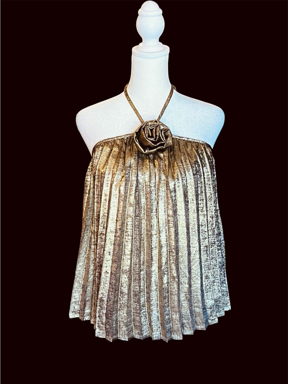 Stellah gold metallic pleated top w/ rosette. Halter neck open back flare M. NWT
